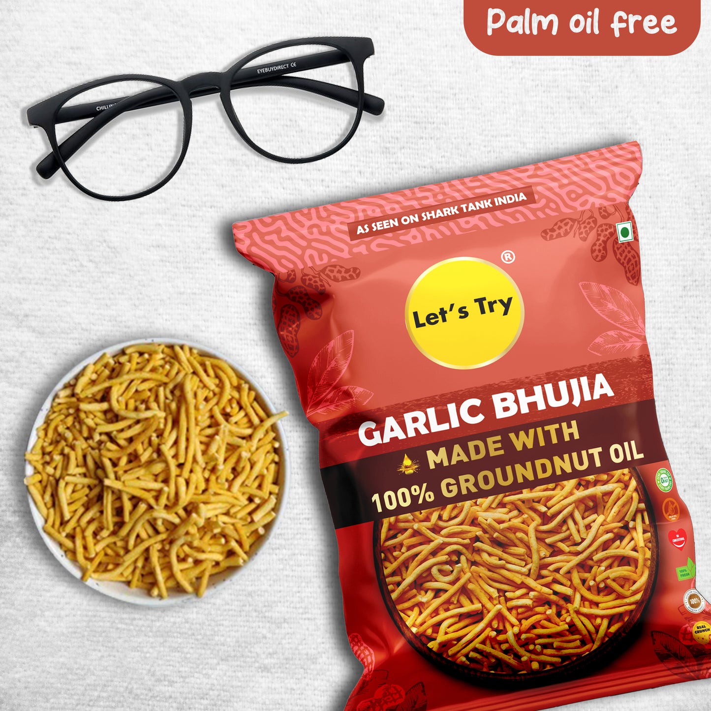 this is Let's Try Garlic Bhujia. Garlic Bhujia is a popular Indian snack made from thin strips of gram flour with the addition of garlic and spices, which are deep-fried until crispy. Let's Try Garlic Bhujia is made with 100% groundnut oil and is free of palm oil. This makes it a healthier option as groundnut oil is a healthier oil compared to palm oil. It is commonly eaten as a snack or as a topping for chaat dishes. The garlic addition gives it a unique and distinct flavor.